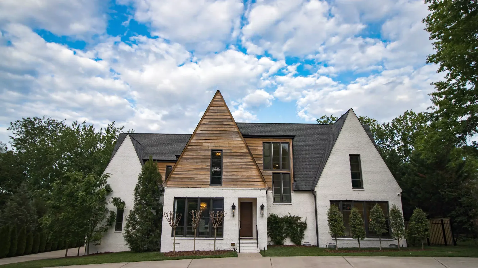 White brick and cedar Nashville home photographed in daylight